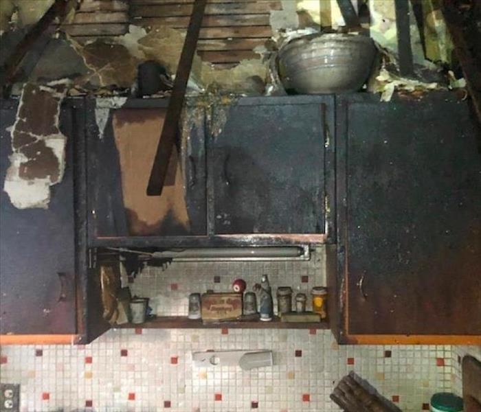 cabinets burned from fire loss in kitchen