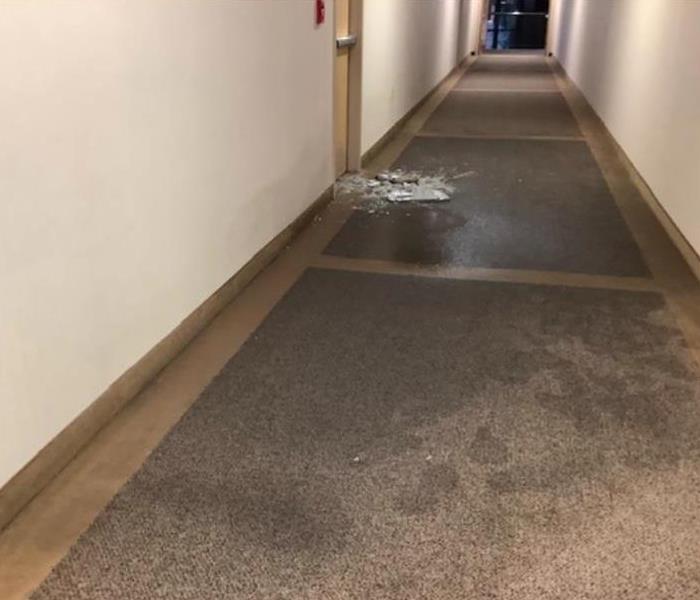 water in hallway of commercial building